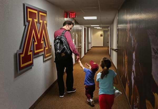 Support group: “My best memories growing up were being in the gym,” said Richard Pitino, with Jack and Ava underneath the court at Williams Arena 