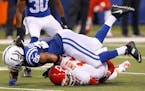 Kansas City Chiefs quarterback Alex Smith (11) is hit and knocked from the game for a second time by Indianapolis Colts free safety Clayton Geathers (