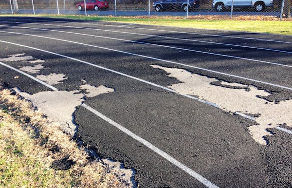 A thin layer that cushions the track at South High School in Minneapolis is peeling and years overdue for resurfacing.