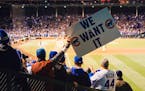 Fans show support for the Chicago Cubs during Game 5 of the World Series against the Cleveland Indians at Wrigley Field in Chicago, Oct. 30, 2016. On 