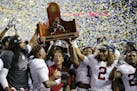 Alabama team members celebrate after the Southeastern Conference championship NCAA college football game against Florida, Saturday, Dec. 3, 2016, in A
