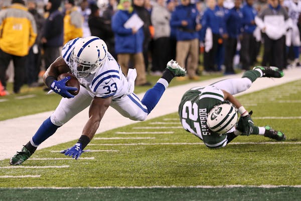Colts rout Jets, move into first-place tie