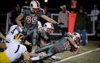 Lakeville North's Wade Sullivan scored a touchdown in the first overtime against Rosemount in October.
