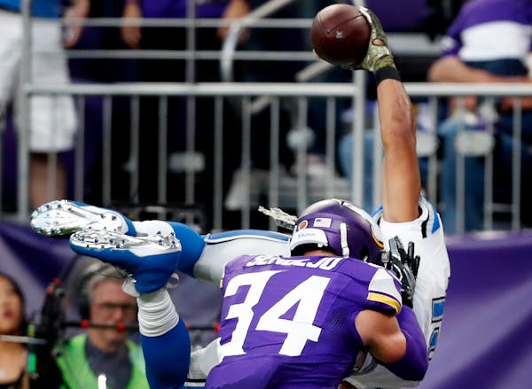 Vikings safety Andrew Sendejo (34) hit Lions receiver Golden Tate as he lunged into the end zone to score the winning touchdown in overtime Nov. 6. De