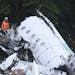Rescue workers search at the wreckage site of a chartered airplane that crashed outside Medellin, Colombia, Tuesday, Nov. 29, 2016. The plane was carr