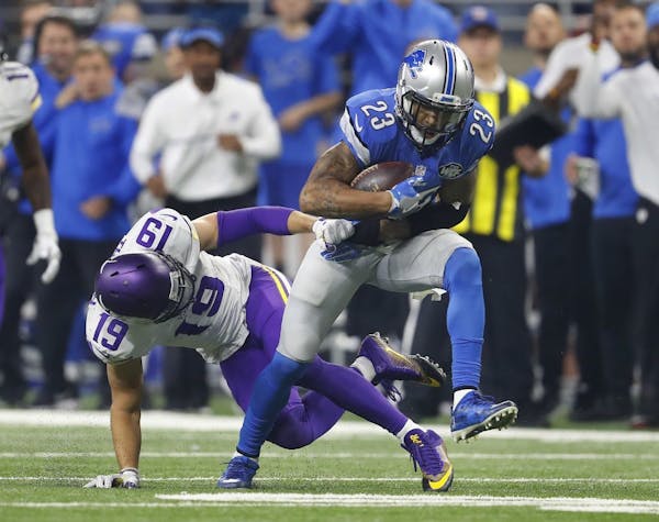 Detroit Lions cornerback Darius Slay (23) intercepts a pass intended for Minnesota Vikings wide receiver Adam Thielen (19) in the fourth quarter of an