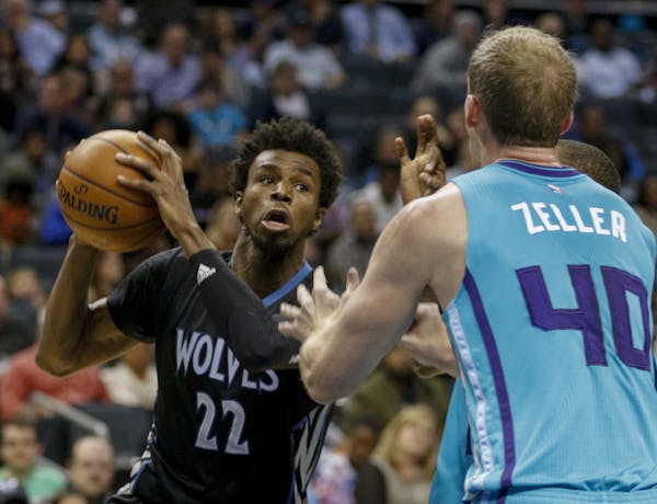 NELL REDMOND • Associated Press
The Wolves’ Andrew Wiggins, left, looked for an opportunity beyond Charlotte center Cody Zeller. Wiggins scored 29