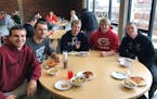 North All-Star football players paused for lunch this week at Augsburg.