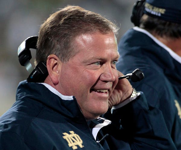 FILE - In this Sept. 15, 2012, file photo, Notre Dame coach Brian Kelly smiles on the sideline during the first quarter of an NCAA college football ga