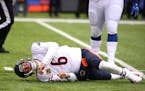 Chicago Bears quarterback Jay Cutler (6) lays on the ground after taking a late hit from New York Giants defensive end Olivier Vernon (54) in the firs