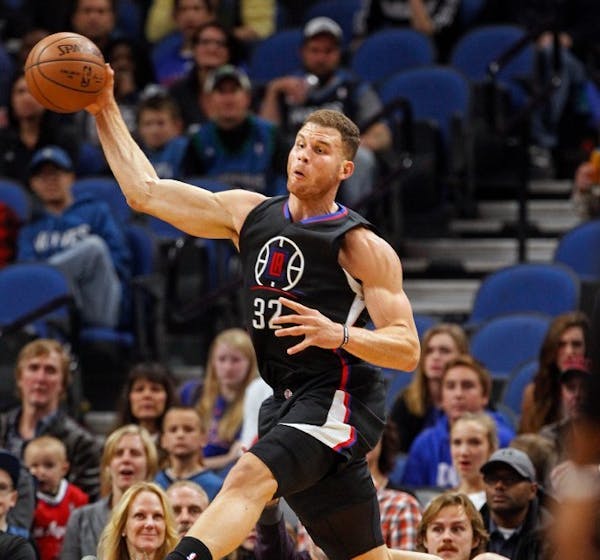 Los Angeles Clippers forward Blake Griffin (32) tries to save a loose ball Saturday night at Target Center.