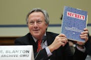 Tom Blanton, director of the National Security Archive, held up a copy of a 1997 congressional report on excessive secrecy.