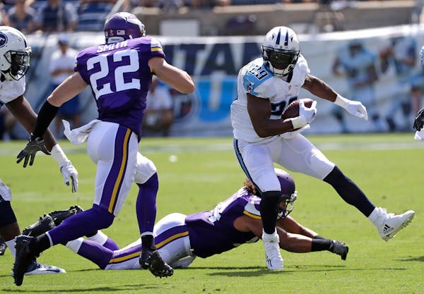 Tennessee Titans running back DeMarco Murray (29) tries to get past Minnesota Vikings safety Harrison Smith (22) in the first half of an NFL football 