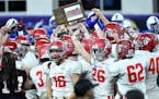 The Elk River players celebrated their Class 5A title after beating Spring Lake Park at the Prep Bowl on Saturday night in Minneapolis.