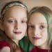 Isabelle, left, and Abby Carlsen pose for a portrait.