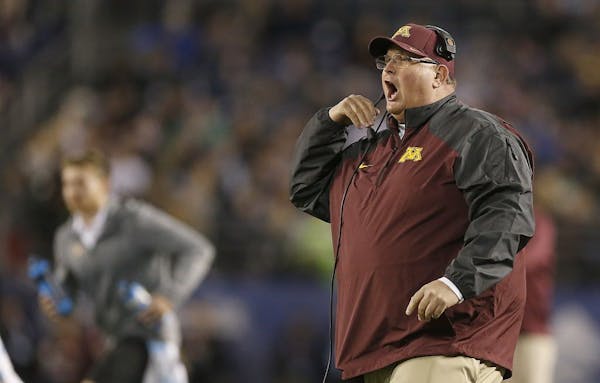 Minnesota head coach Tracy Claeys disputes a call during the second quarter against Washington State during the Holiday Bowl at Qualcomm Stadium in Sa