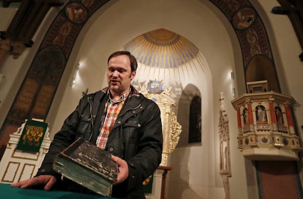 The Rev. Helge Voigt held a Bible that dates to Martin Luther’s time. Years of Soviet rule quashed faith in East Germany.