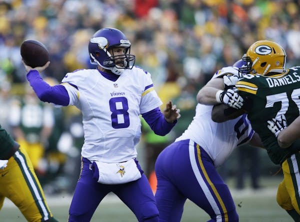 Minnesota Vikings' Sam Bradford throws during the first half of an NFL football game against the Green Bay Packers Saturday, Dec. 24, 2016, in Green B