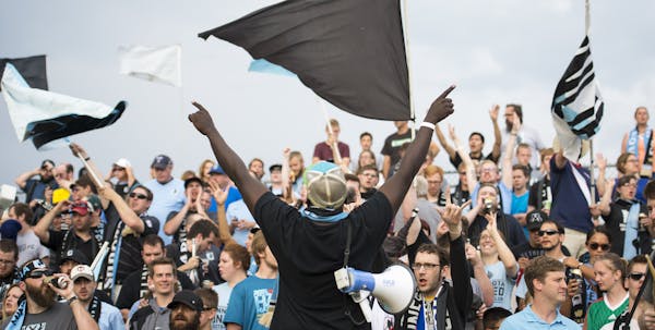 The Dark Clouds – the loud and loyal supporters of Minnesota United FC, shown above being led by Abraham Opoti, center – are ready to follow their