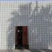 The main entrance to the Parker Palm Springs Hotel is behind a wall of decorative cinder blocks..