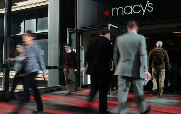 Pedestrians enter and exit Macy’s via the skyway Thursday. Macy’s is one of the busiest spots in the skyway with an estimated 15,000 trips a day.