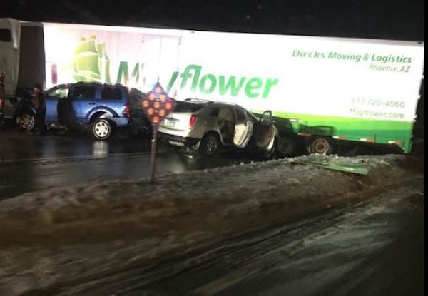 Two vehicles crashed into a jackknifed semi Monday night on Hwy. 52 near Hwy. 55 in Inver Grove Heights.