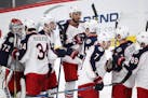 Columbus Blue Jackets players celebrate with Columbus Blue Jackets goaltender Sergei Bobrovsky (72) after defeating the Minnesota Wild to end their 12