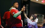 Ten-year-old Jackson Roethler found Twins slugger Miguel Sano to be a handful, and then some, during fan activities on the last day of TwinsFest 2016.