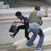 A law enforcement officer evacuates a civilian from an area at Fort Lauderdale-Hollywood International Airport, Friday, Jan. 6, 2017, in Fort Lauderda