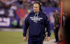 New England Patriots head coach Bill Belichick walks on the sideline during the second half of an NFL football game against the New York Giants Sunday