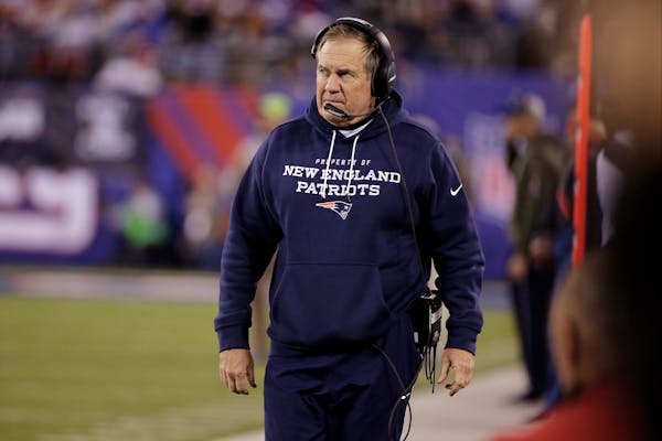 New England Patriots head coach Bill Belichick walks on the sideline during the second half of an NFL football game against the New York Giants Sunday