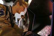 Erik Derby, 18, of Mantorville, plays Pac-Man at the Machine Shed in Rochester.