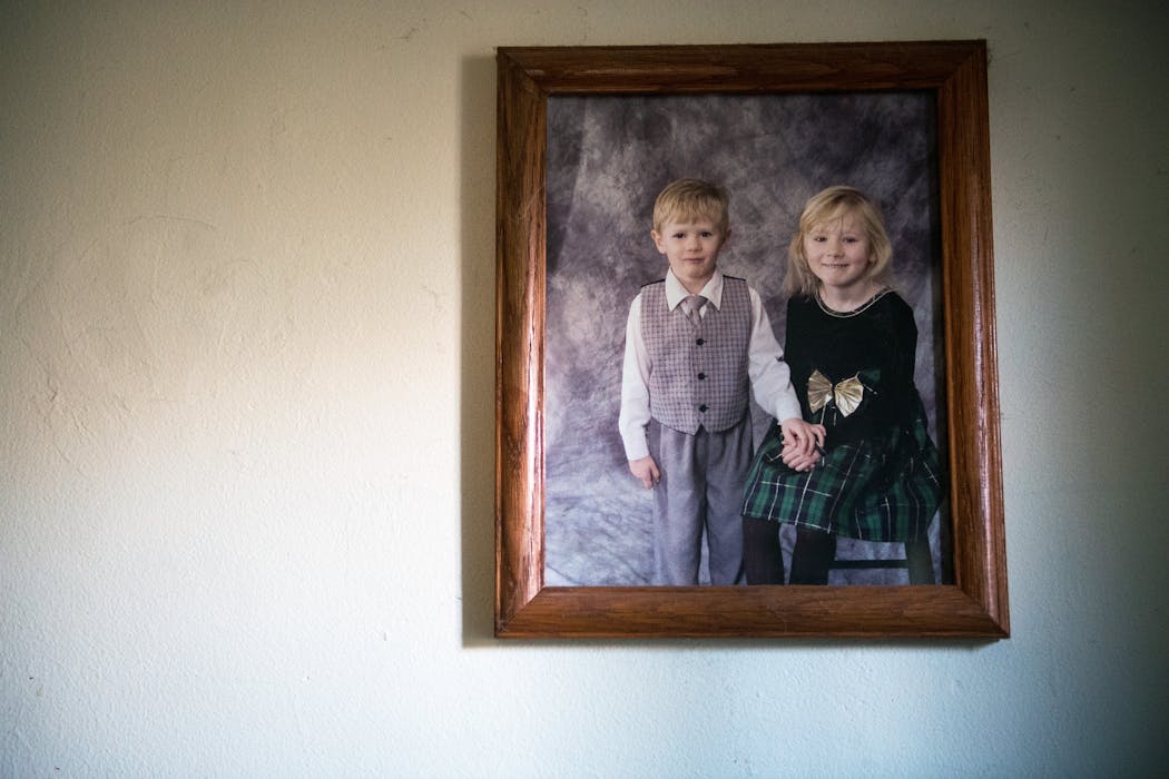 A portrait of LaDue and his sister, Valerie, as young children, hangs in their family's living room.