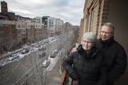 Jan and Art Larson on the balcony of their downtown Minneapolis condo.
