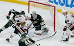 The Blackhawks' Patrick Kane (88) controlled the puck before passing it to teammate Jonathan Toews for the game-winning goal against the Wild in overt