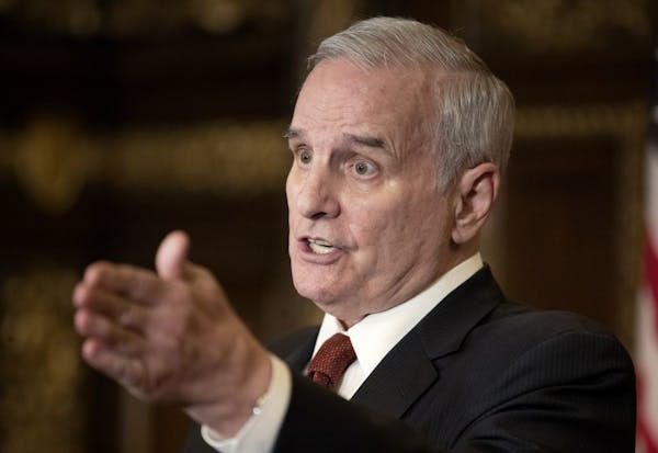 Gov. Mark Dayton, shown at a news conference on Thursday, said that he expects to appoint an interim chair to replace Michele Kelm-Helgen at the stadi