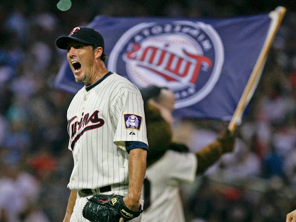 Twins closer Joe Nathan lets out a yell after getting the final out in the ninth inning of the Minnesota Twins 4-3 win over Kansas City at Target Fiel