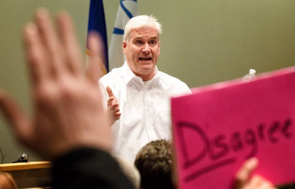 Rep. Tom Emmer faced a crowd at a town hall meeting Wednesday night in Sartell, Minn.