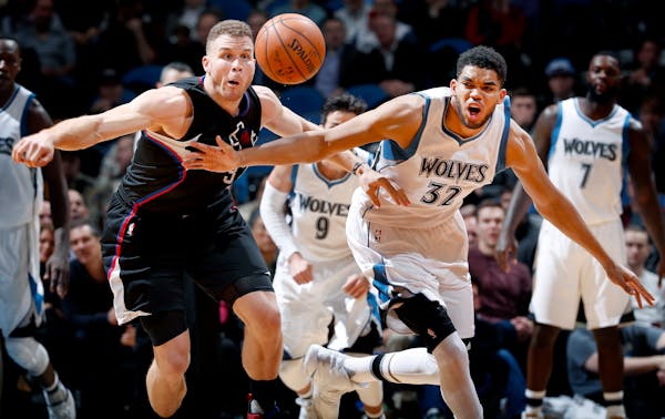 Blake Griffin (32) and Karl Anthony Towns (32) fought for a loose ball in the second quarter. ] CARLOS GONZALEZ � cgonzalez@startribune.com - March 