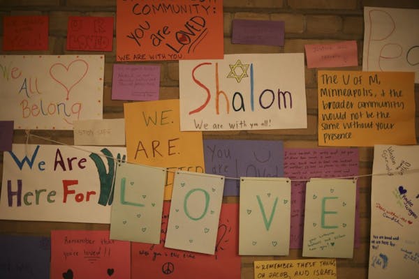 Some of the signs that supporters, including at group from the U's Lutheran Campus Ministry, put up on a wall in the lobby of Minnesota Hillel on Thur