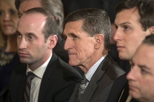 Stephen Miller, left, a presidential adviser, and National Security Adviser Michael Flynn at a joint news conference held by President Donald Trump an