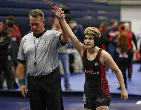In this Feb. 18, 2017 photo, Euless Trinity's Mack Beggs is announced as the winner of a semifinal match after Beggs pinned Grand Prairie's Kailyn Cla