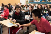 Richfield tenth-graders Kenny Tran and Caleb Sotl compared results during their pre-calculus class. Richfield High School has seen an increase in grad