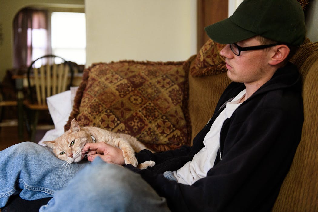 John LaDue spent quality time with Mittens, one of his three cats.