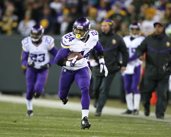 Minnesota Vikings cornerback Captain Munnerlyn (24) picked up a Aaron Rodgers fumble and ran it back for a 55 yard touchdown in the third quarter Sund