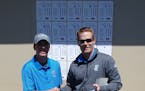 Blaine sophomore Caleb VanArragon and coach Kevin Overgaard after VanArragon shot what is believed to be a boys' state-record round of 63.