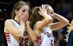 Orono guard Madeline Loder (22) and forward Anna Hughes (5) celebrated their 65-47 victory over Winona in the Class 3A girls' championship game.