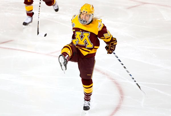 Minnesota's Sarah Potomak celebrates her goal 13 seconds into the game during the first period of the NCAA women's Frozen Four championship college ho