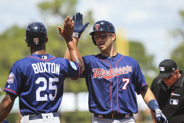 The Twins’ Byron Buxton high-fived Joe Mauer after Mauer hit his first home run of the spring in his team’s final game against a big-league team.