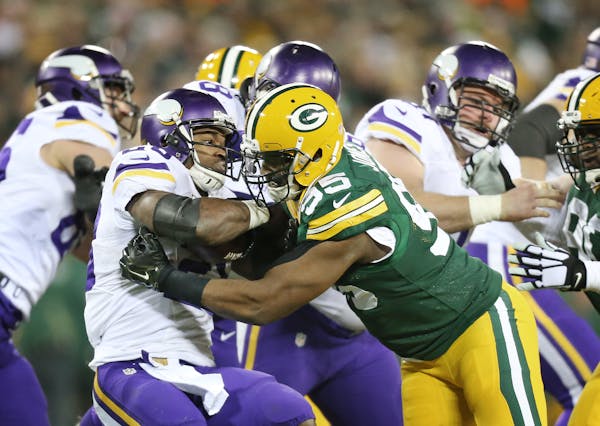 Vikings running back Adrian Peterson was stopped for no gain by Green Bay defensive end Datone Jones in 2016. Jones on Tuesday signed with the Vikings
